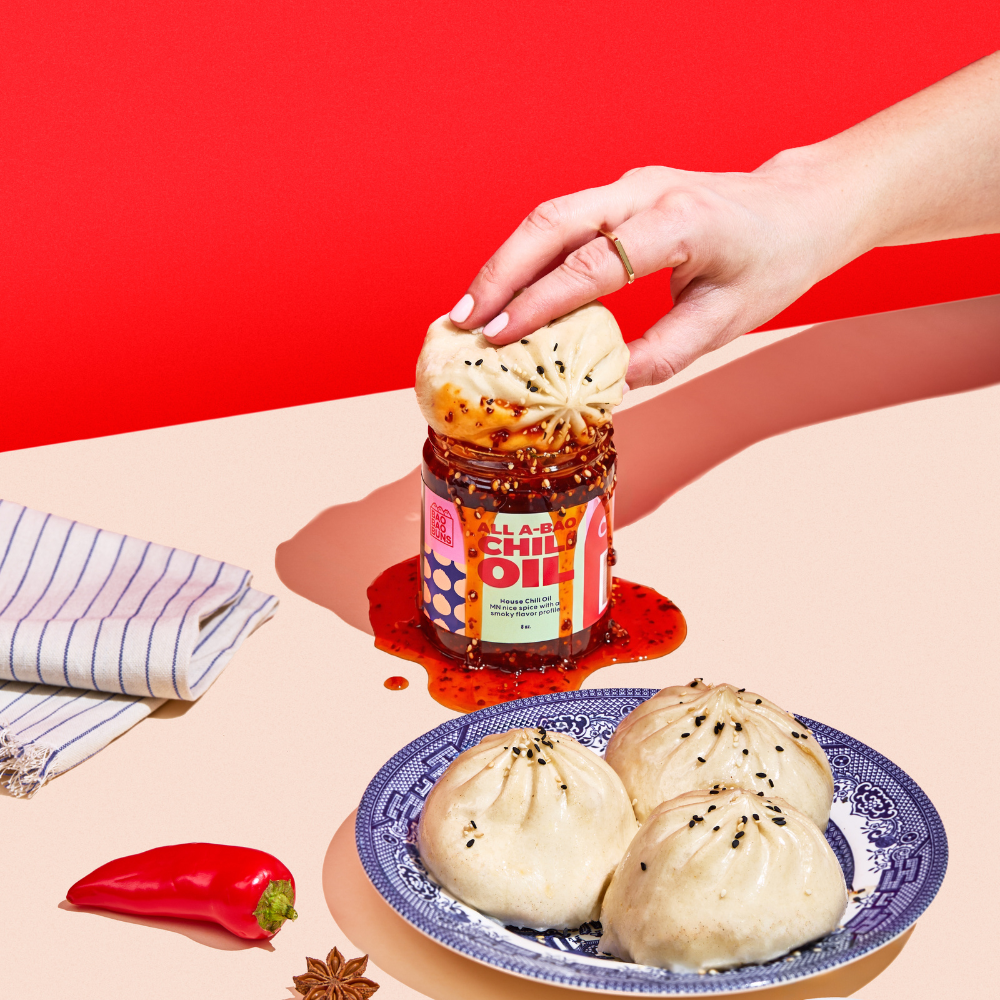 Bao dunked in chili oil jar